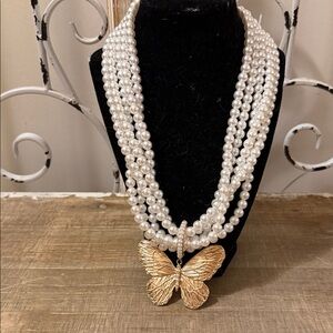 Luxurious Multi-Strand Pearl Necklace with Gold Butterfly